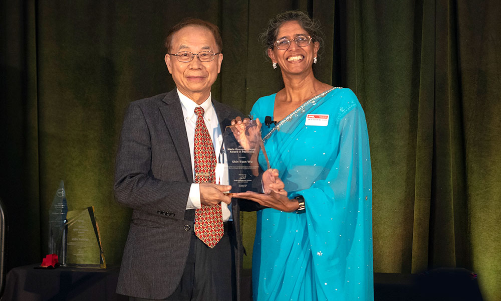 An award recipient receiving their SPIE Award.