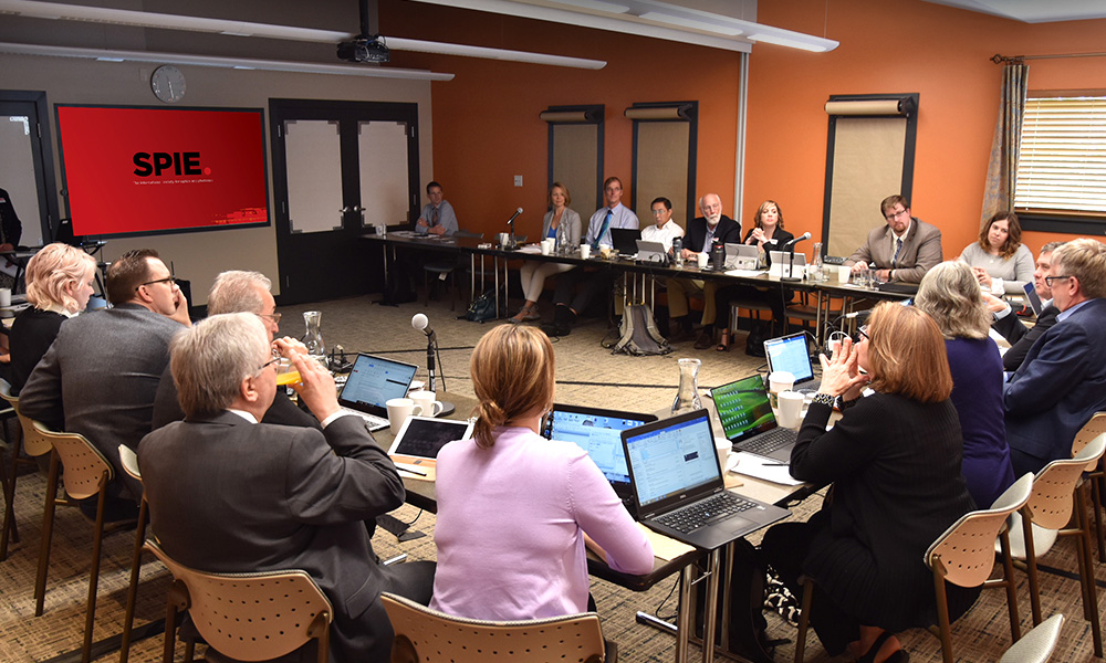 Committee gathering around a table