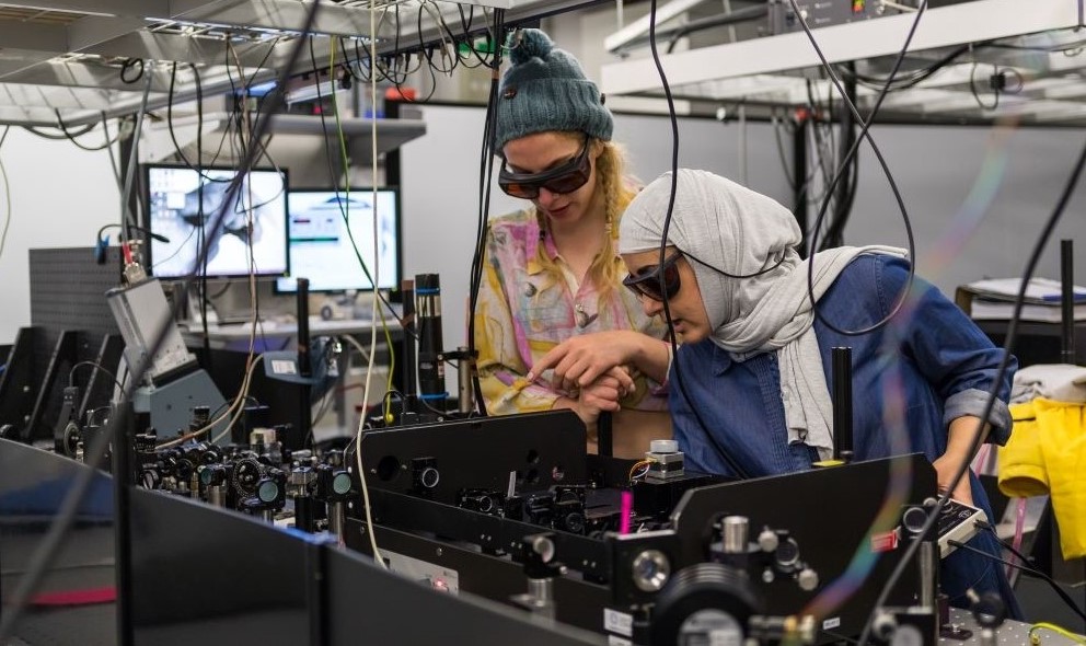 An image of doctoral students working in The University of Manchester's Photon Science Institute lab