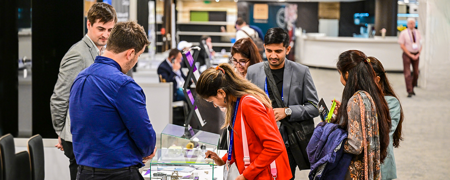 Attendees visit exhibitor booths