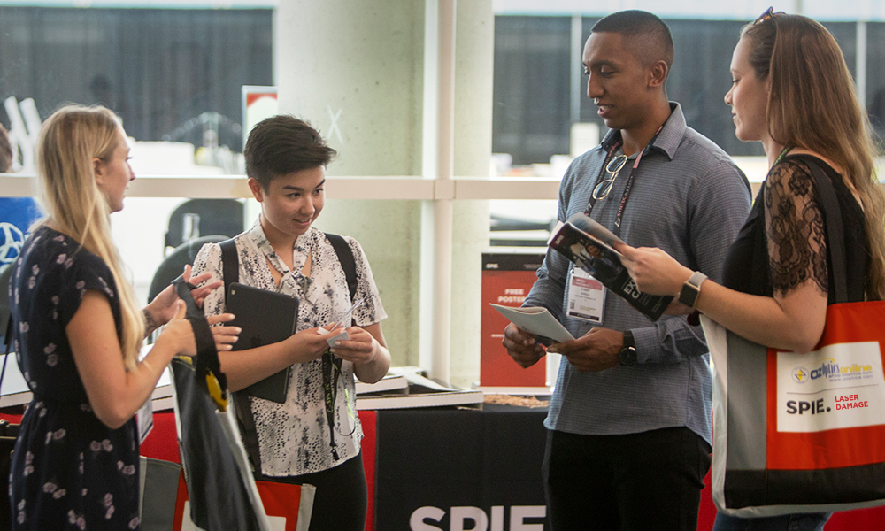 Attendees pick up registration materials