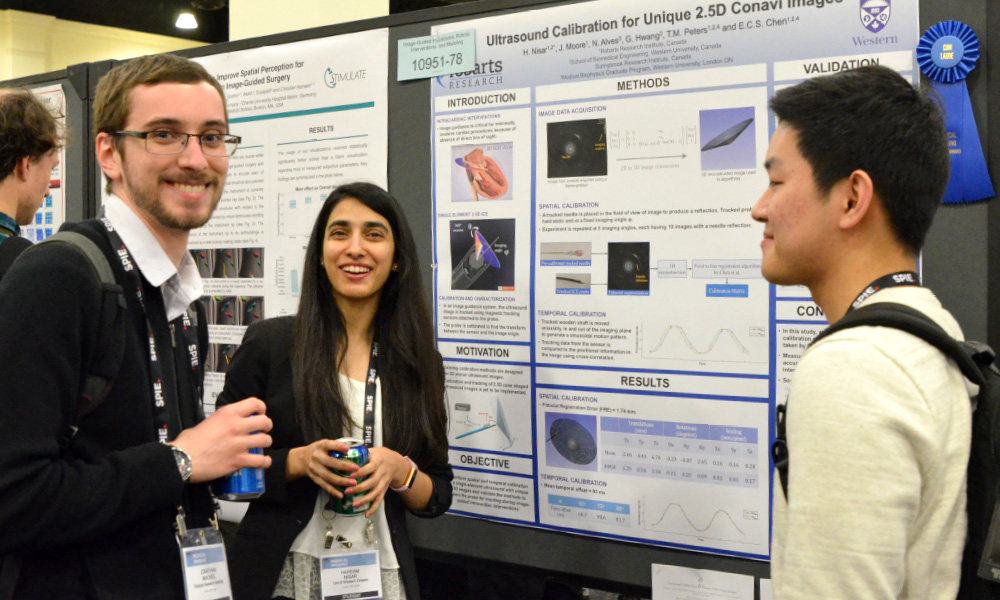 An author and their poster presentation at SPIE Optics + Optoelectronics