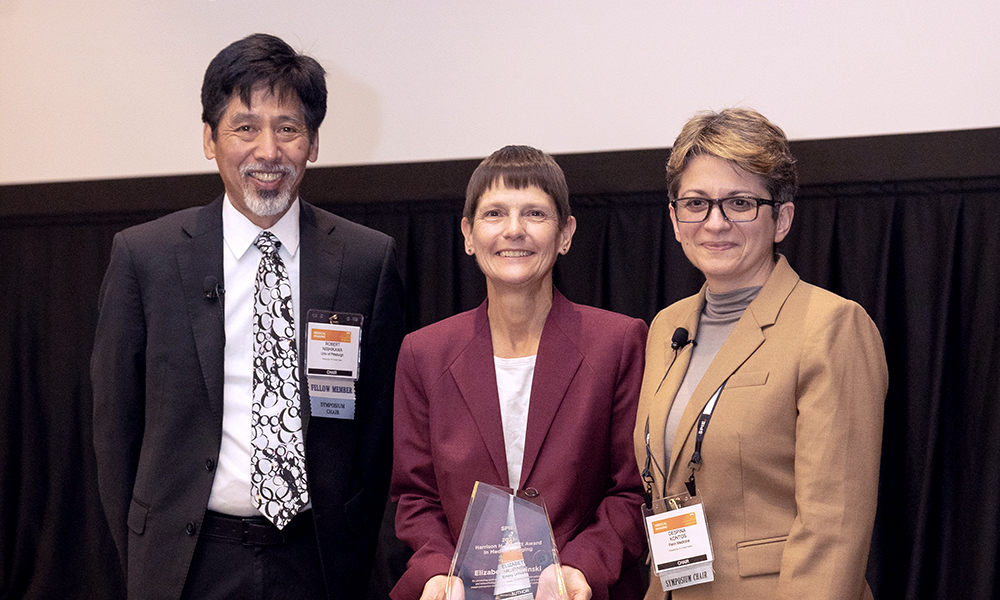 Chairs and committee members organize the conferences and present awards to authors