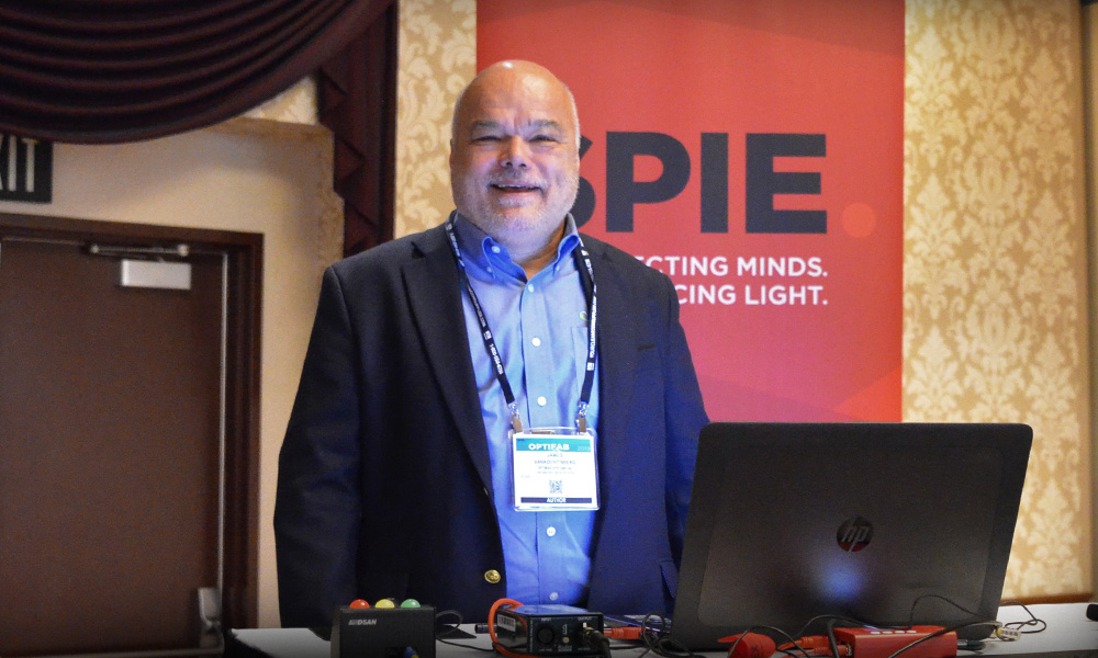 Presenter prepares his video recording for SPIE Optifab