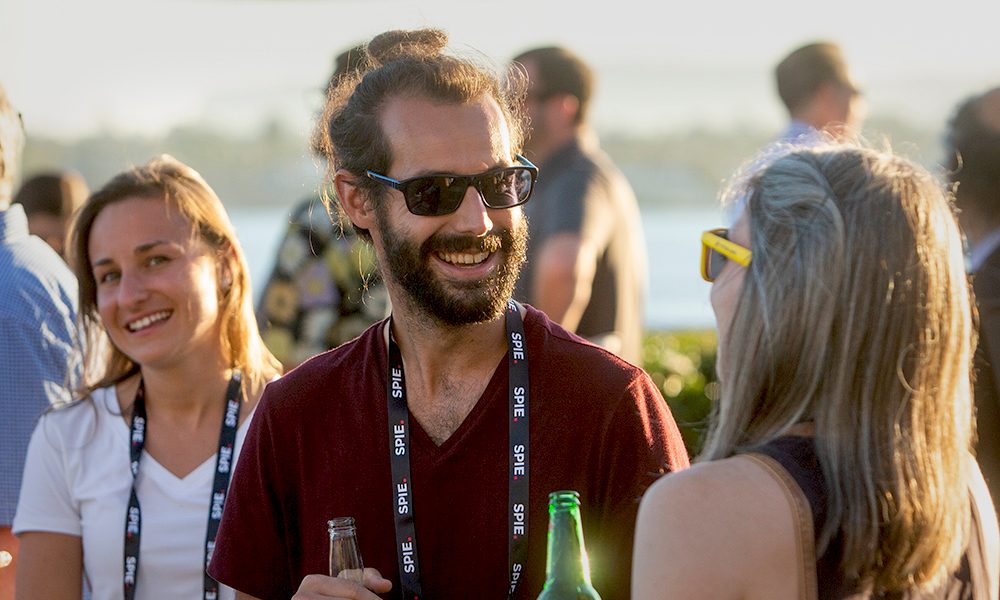 Attendees mingle at a social event