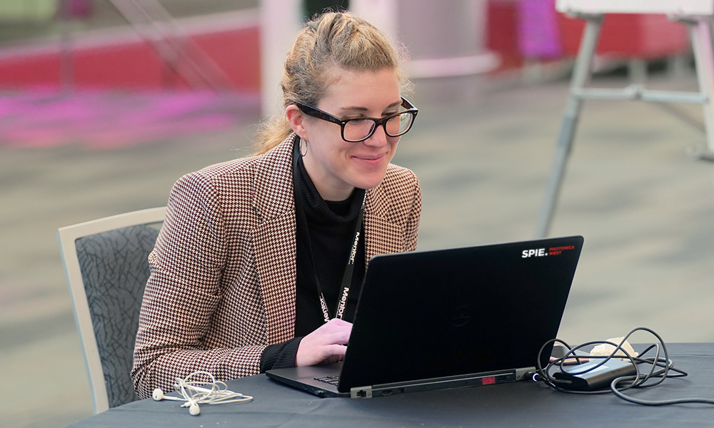 Woman engages with audience during an SPIE.Online webinar