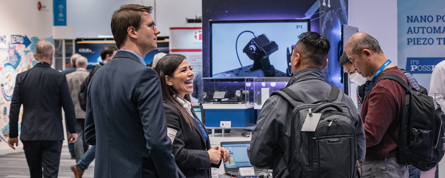 Attendees on the exhibition floor at SPIE Photonics Europe