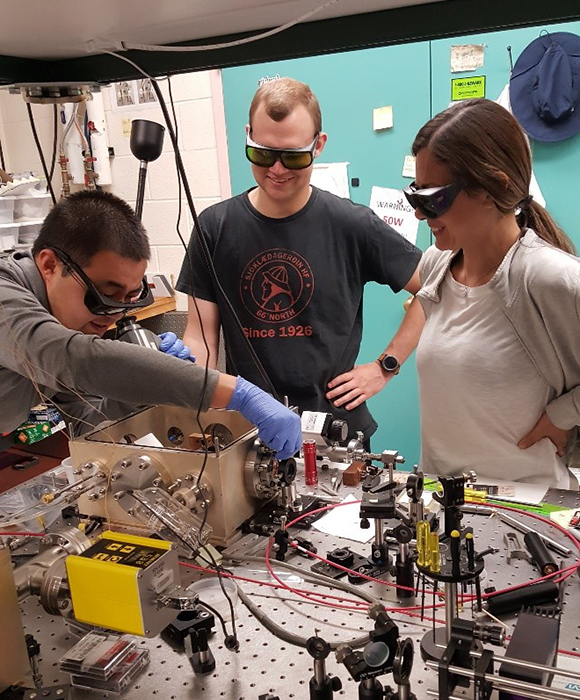 Junwei and colleagues working in the UNM lab