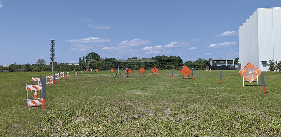 large highly reflective signs, or “confusers,” are placed near test targets 